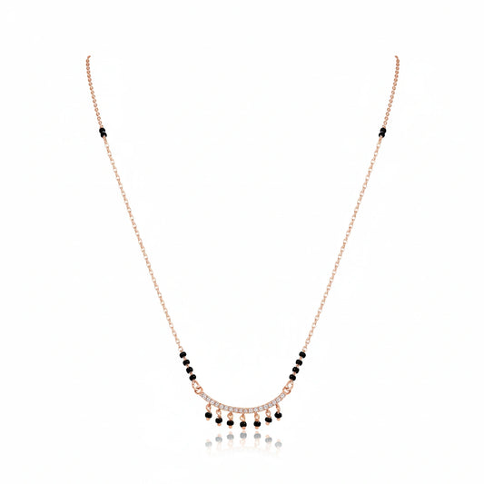 Rose gold bridal mangalsutra with black bead chain and diamond-studded choker pendant with dangling black bead drops on white background