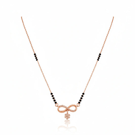 Rose gold infinity mangalsutra with black bead chain, diamond-studded infinity symbol and floral drop pendant on white background