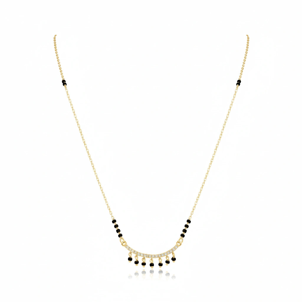 Gold bridal mangalsutra with black bead chain and diamond-studded choker pendant with dangling black bead drops on white background