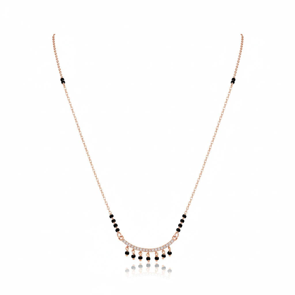 Rose gold bridal mangalsutra with black bead chain and diamond-studded choker pendant with dangling black bead drops on white background