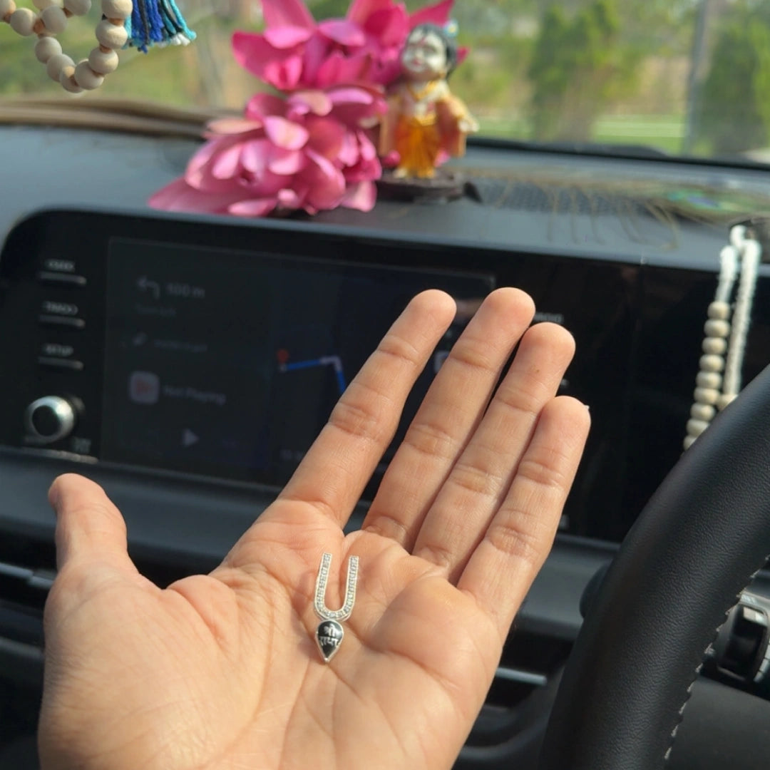 Customer holding Shri Radha diamond U-shaped silver pendant in hand, real buyer review photo